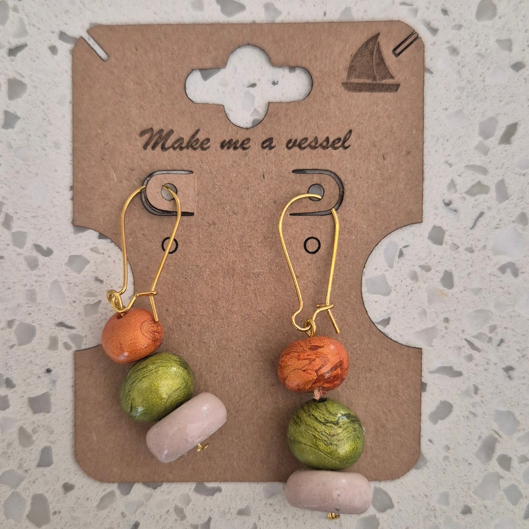 Golden three tiered drops with brown green and white.