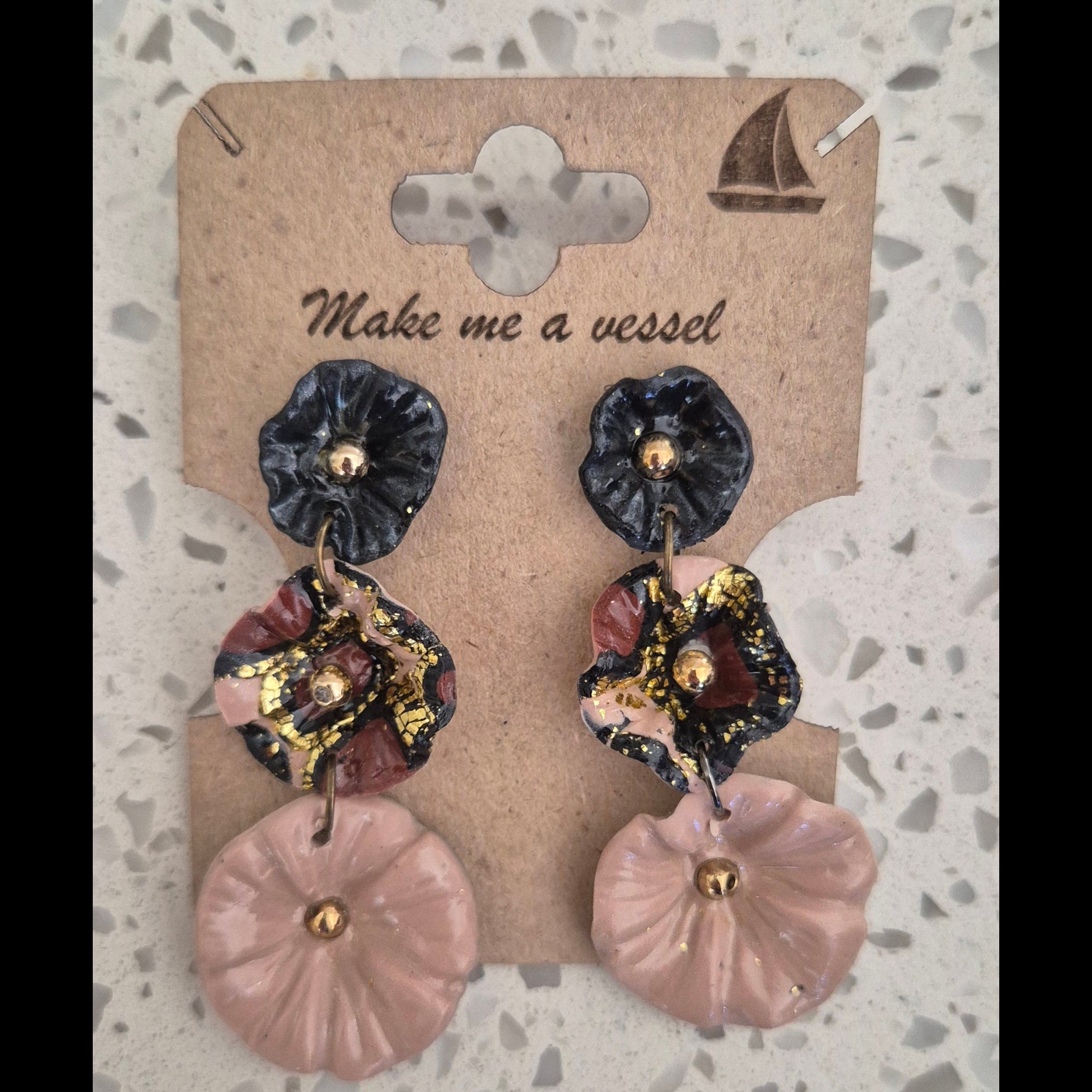 3 Tiered flowers with black, beige and brown and gold finishing.