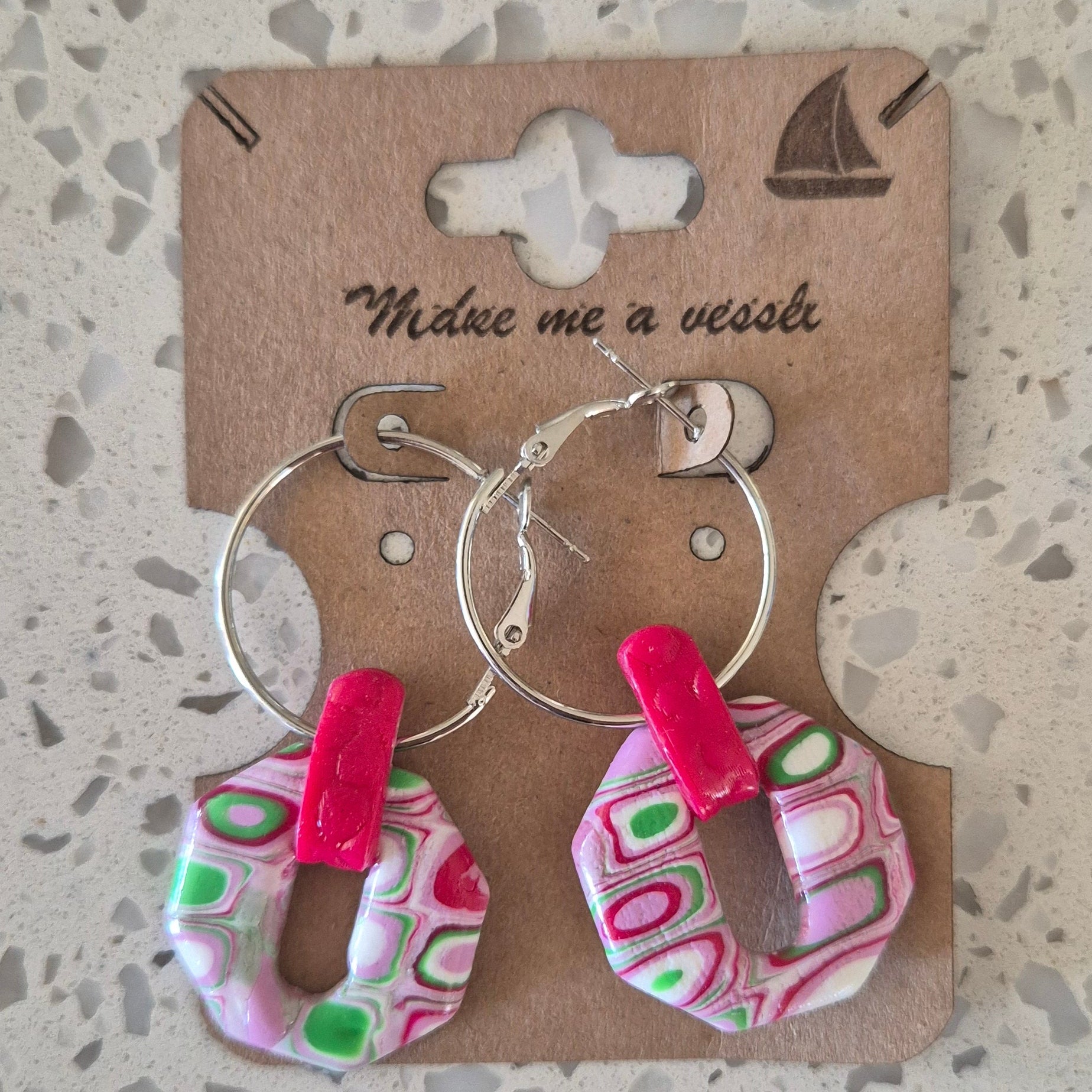 Marbled pink and green geometric shaped with silver hoops