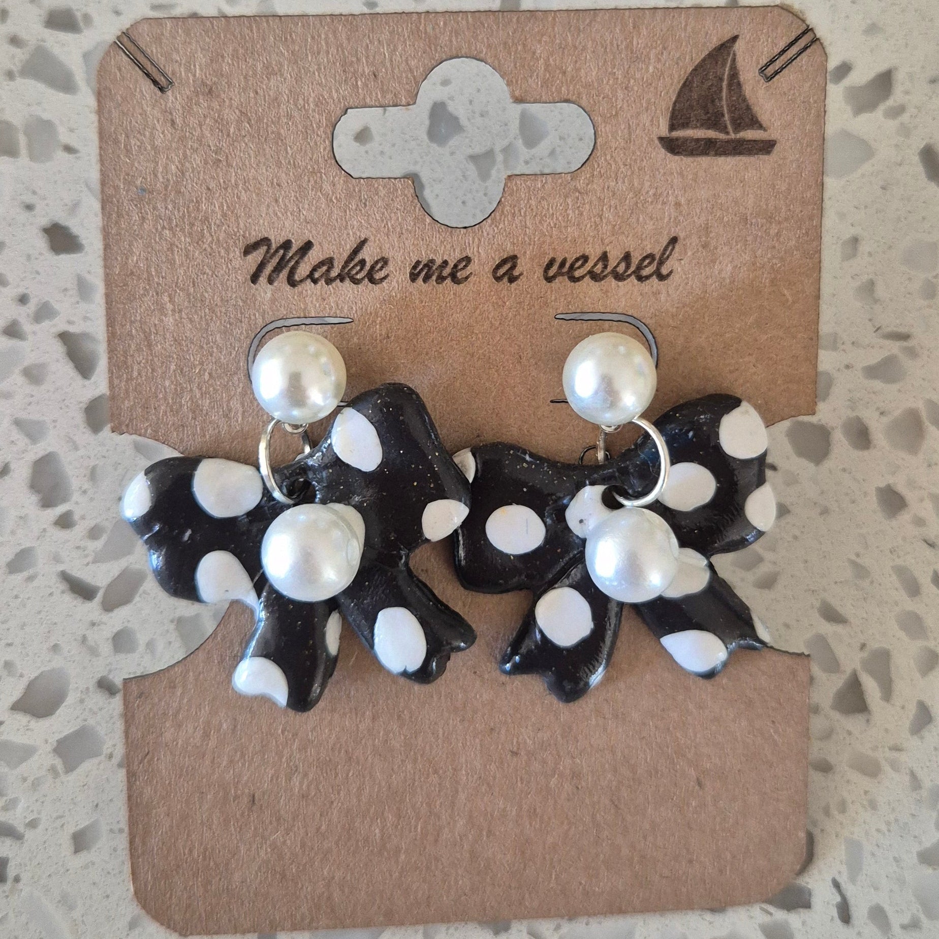 Black and white ribben with pearl finishing earrings