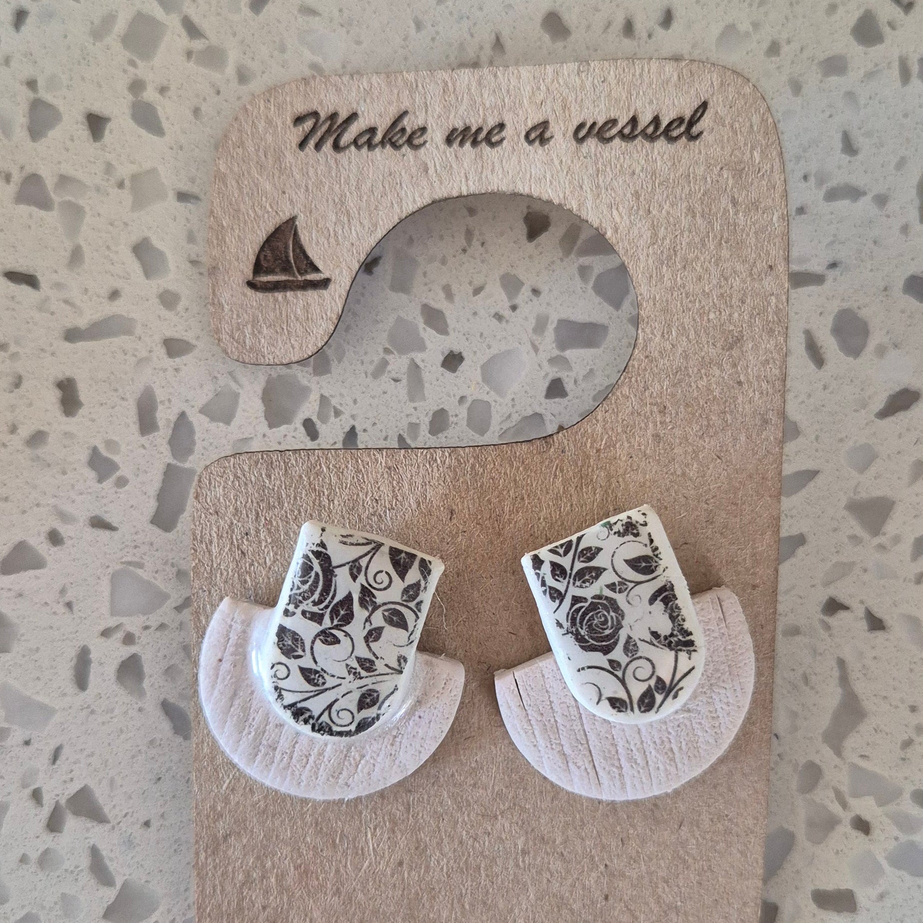 Wooden heart puzzle with engraved text on a textured surface