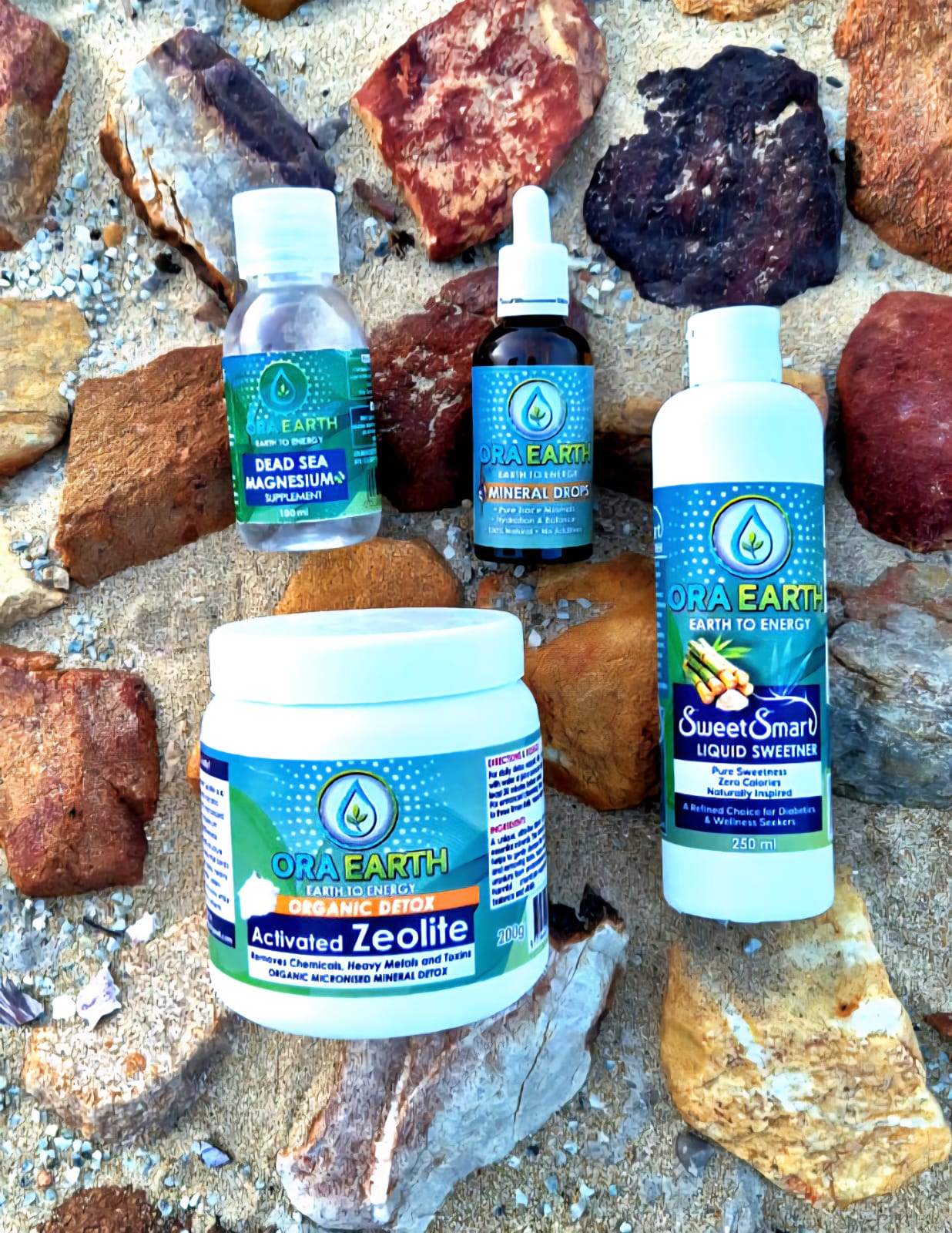 Ora Earth products including bottles and a jar on a rocky surface
